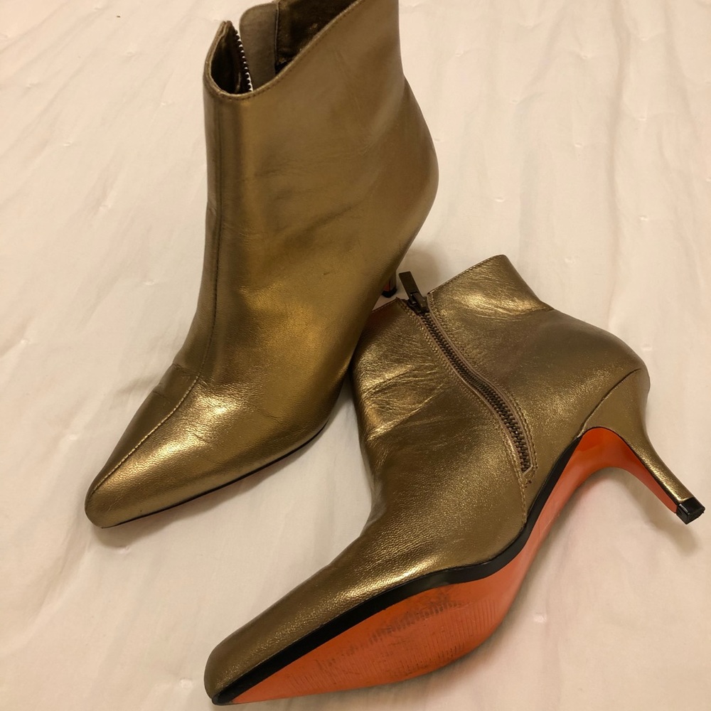 Leather gold booties with orange sole